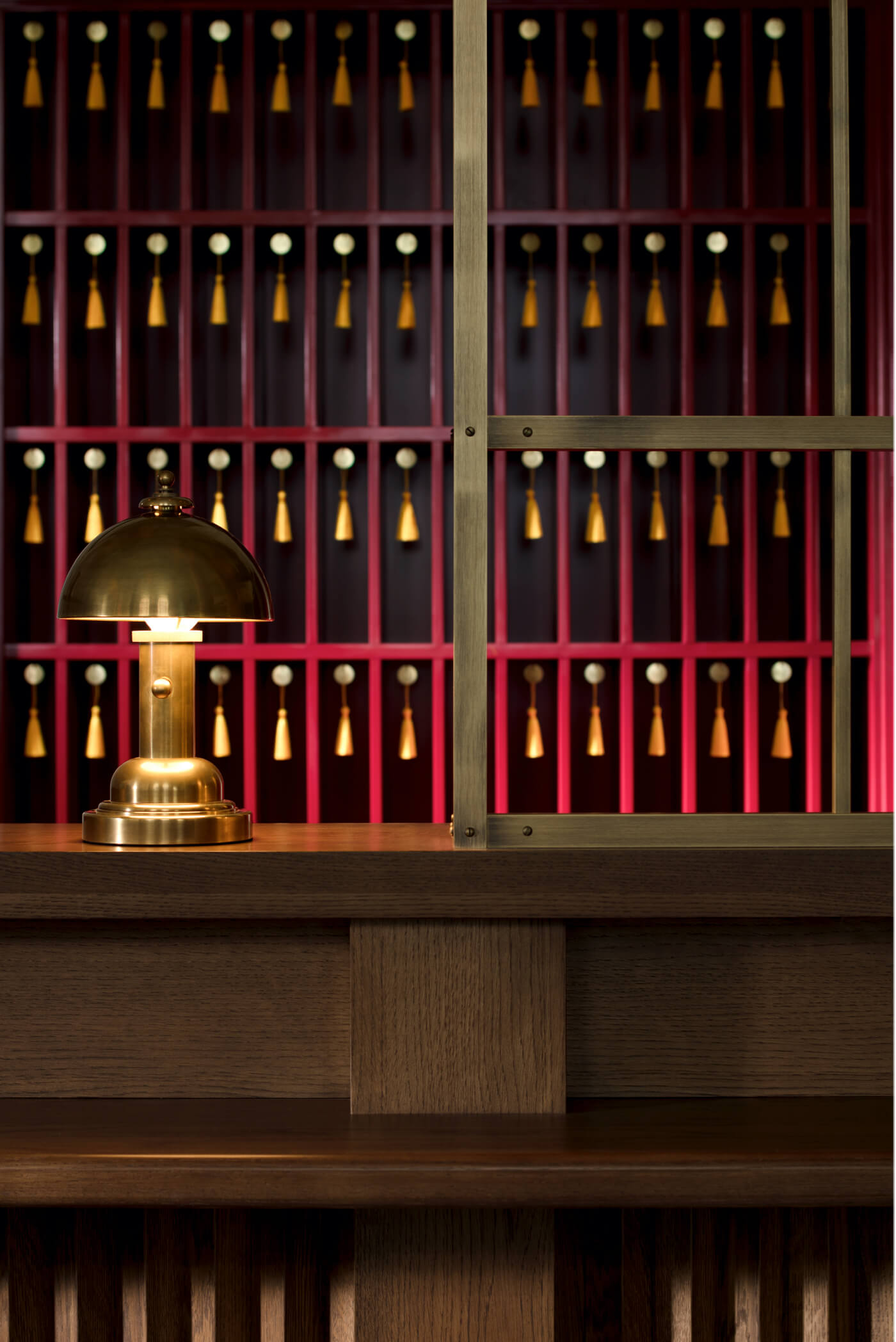 Luxurious suite with a cosy fireplace, chic armchairs, and an elegant chandelier hanging above a spacious living area.