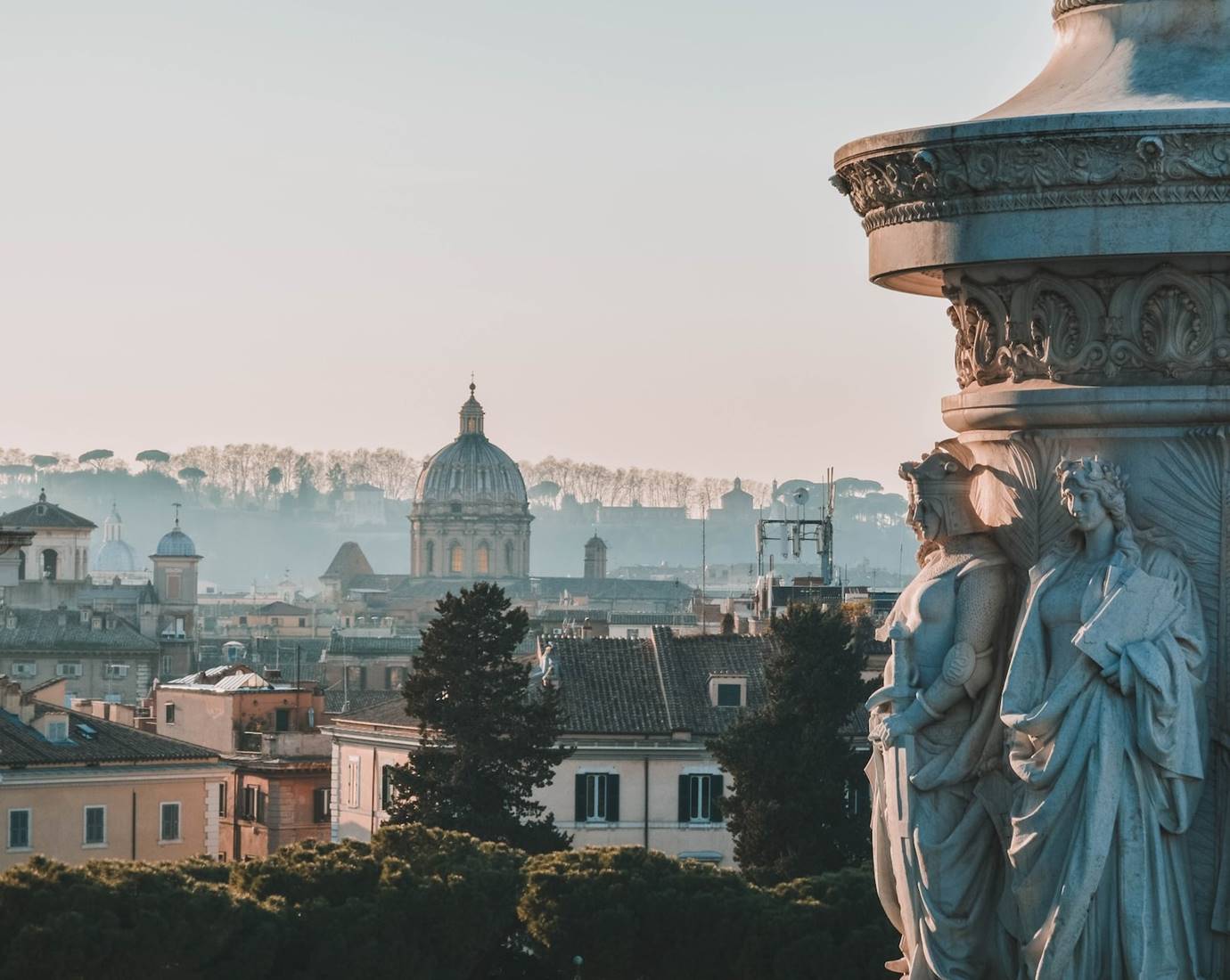 Beautiful city centre of Rome with traditional buildings and trees.