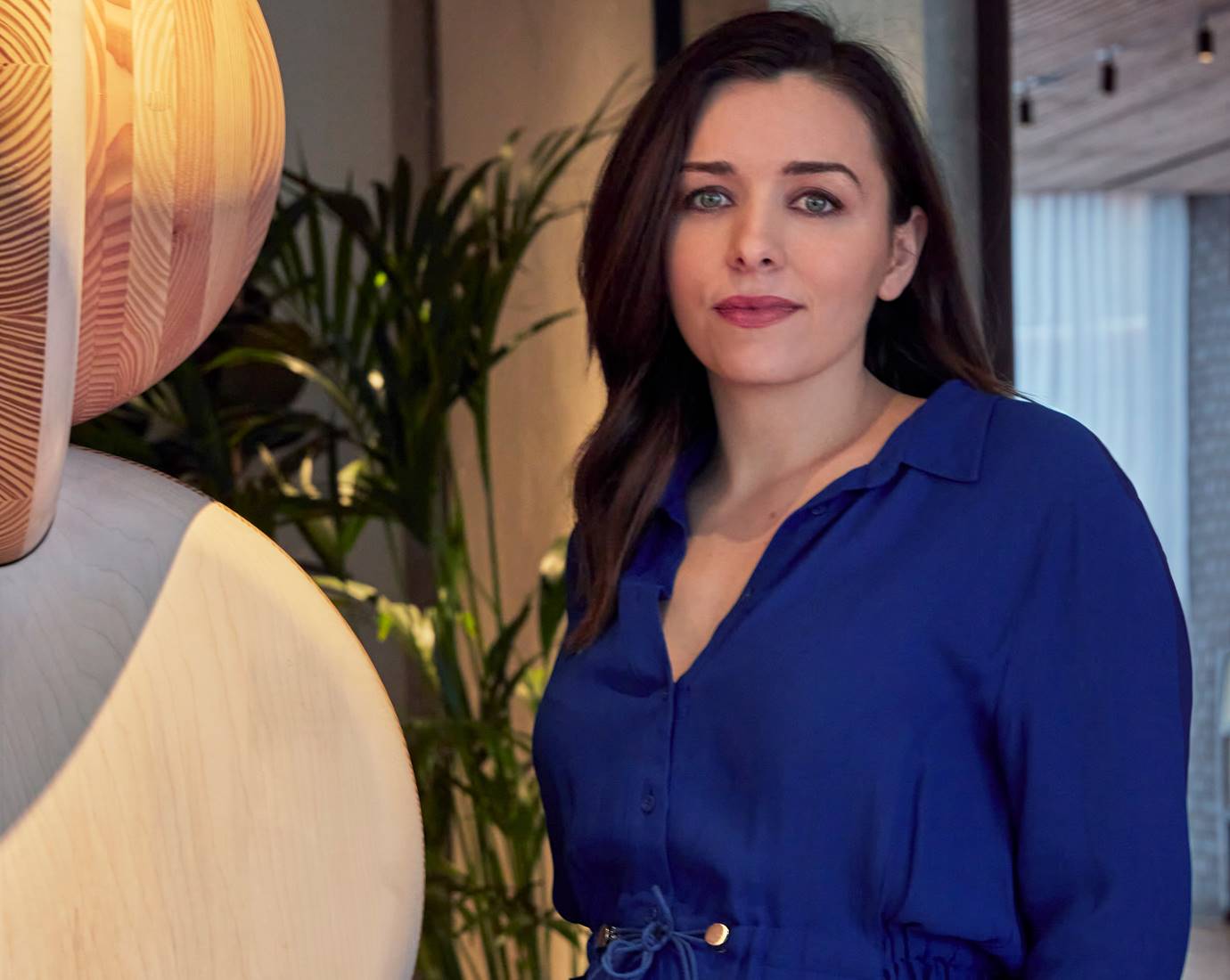 Portrait of Caitriona O'Sullivan, the Design Director of Lore Group in a dark blue blouse.