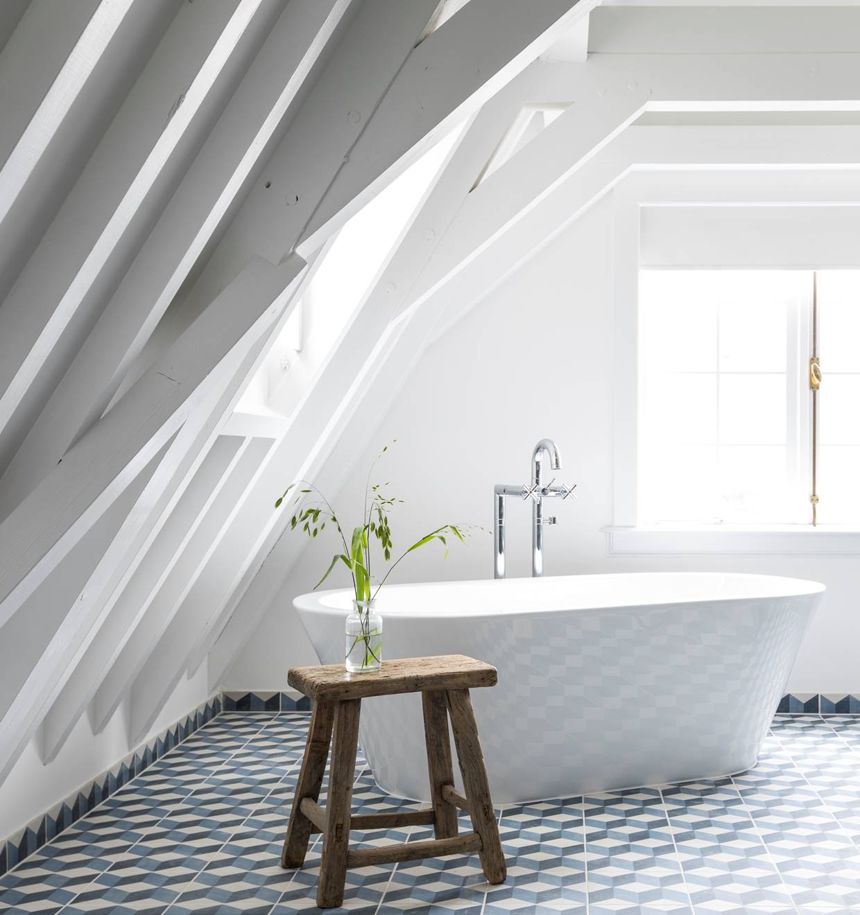 A luxurious bathroom with a large bathtub, modern fixtures, and elegant marble accents.