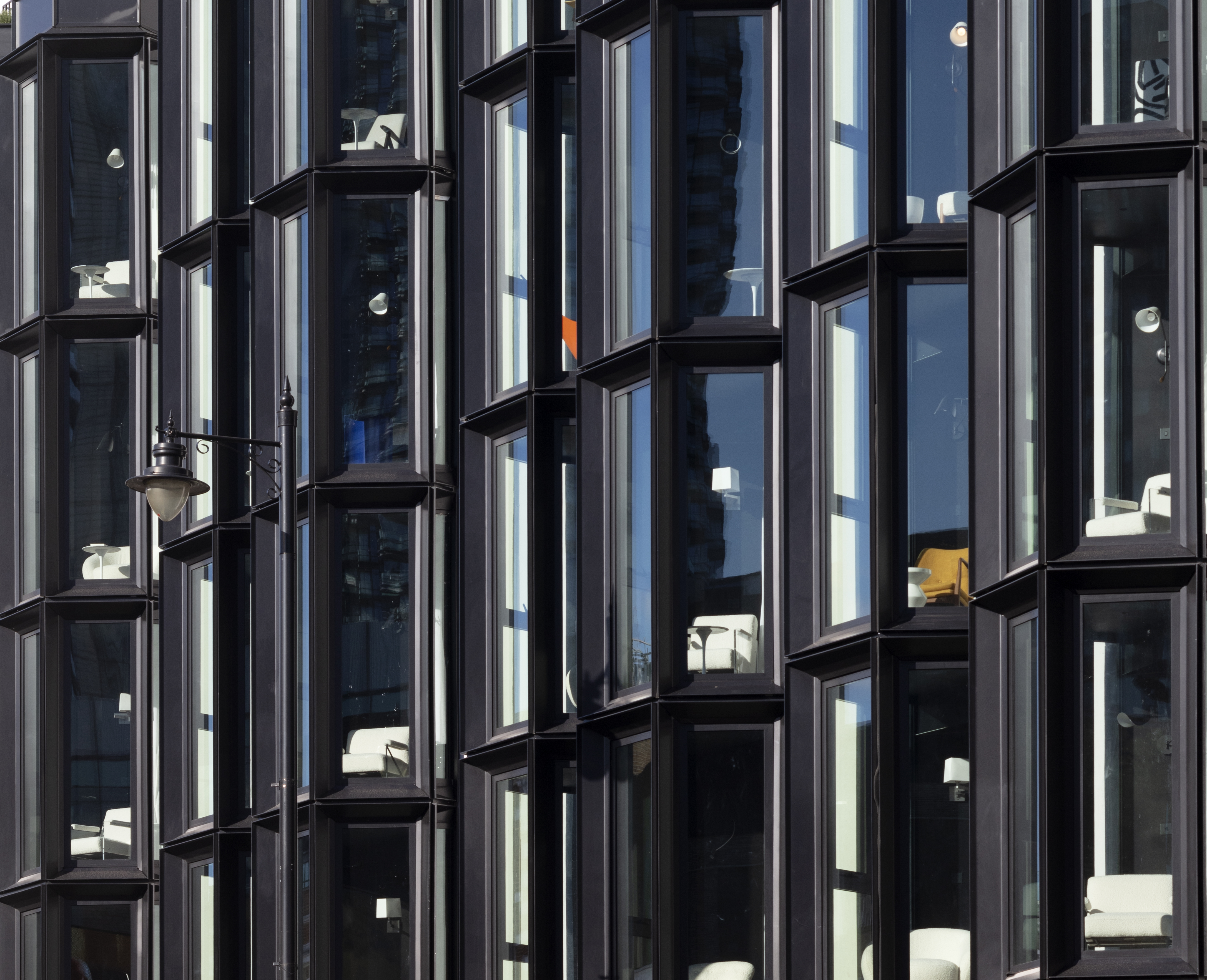 Close-up of hotel room windows in an exterior shot of the stylish and modern One Hundred Shoreditch hotel in London.