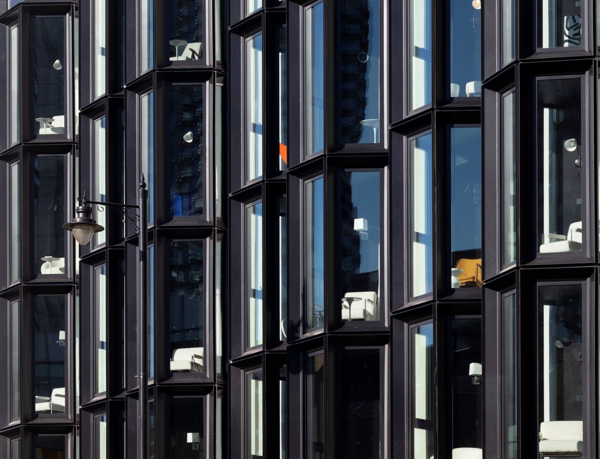 Close-up of hotel room windows in an exterior shot of the stylish and modern One Hundred Shoreditch hotel in London.