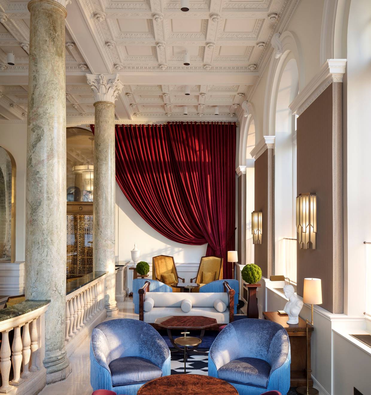 A luxurious lounge with elegant seating, warm lighting, and a sophisticated ambiance.