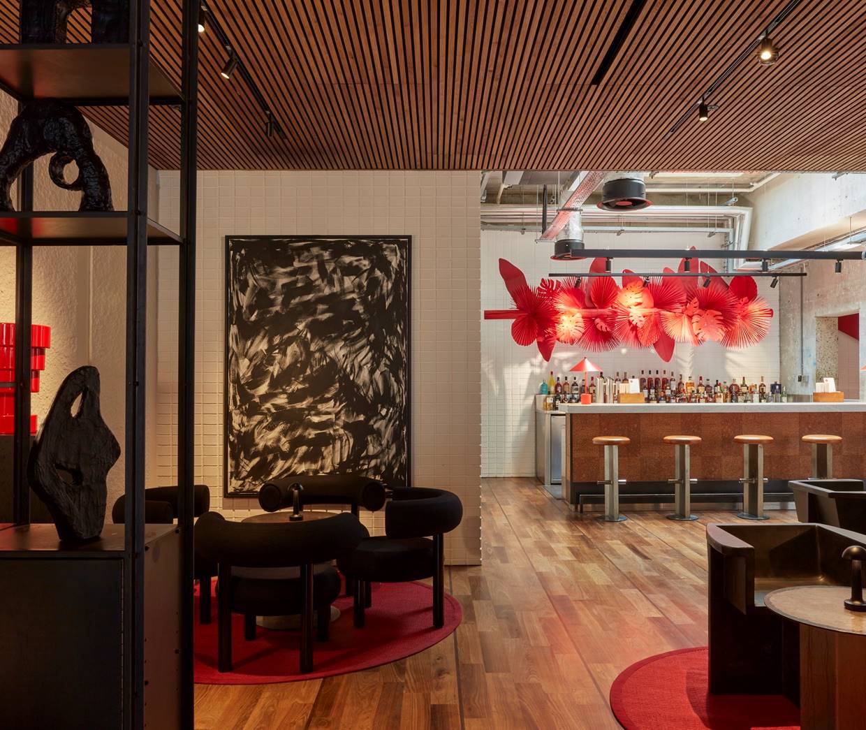 A vibrant lobby bar with comfortable seating, modern decor, and a welcoming atmosphere.